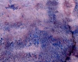 Abstract hand painted violet blue, purple watercolor on textured background photo