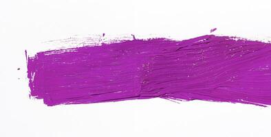 Purple brush stroke isolated over white background photo