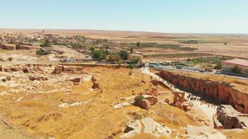 Aerial static view Dara ancient city panorama with many tourist groups exploring area in summer. Daras east roman fortress city in northern mesopotamia. Travel destination in Mardin province, Turkey video