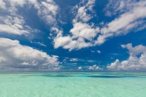 Seascape with sea horizon and deep blue sky in calm and sunny weather. Panoramic beautiful seascape with cloud on a sunny day. Endless blue sea view photo