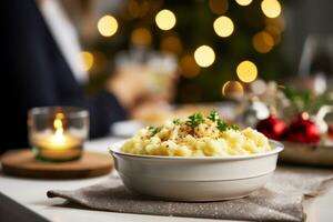 AI generated Mashed potatoes served on festive table with family in background at home photo
