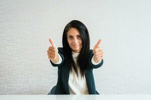 Young caucasian brunette business woman director in office photo