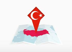 Turkey is depicted on a folded paper map and pinned location marker with flag of Turkey. vector