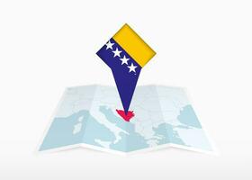 bosnia y herzegovina es representado en un doblada papel mapa y clavado ubicación marcador con bandera de bosnia y herzegovina vector