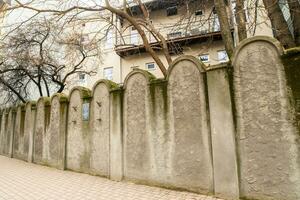 Krakow, Poland,  2023 - Fragment of the wall of Jewish Ghetto in Krakow, Poland. Ghetto Walls were built in style of Jewish graves symbolizing destiny of enslaved people. photo