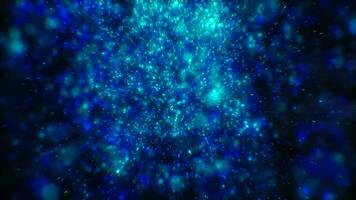 Blurred blue abstract background of bokeh and small round particles of energy magical holiday flying dots on a black background video