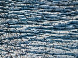 Svnafellsjkull Glacier in Iceland. Top view. Skaftafell National Park. Ice and ashes of the volcano texture landscape, beautiful nature ice background from Iceland photo