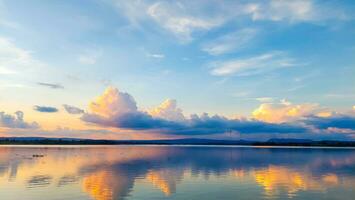 Sunset reflection and clouds in the reservoir photo