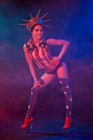 Young woman in stage costume of striptease dancer posing photo