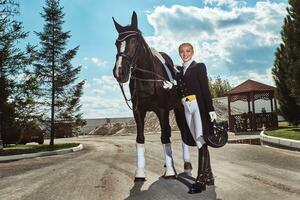 woman jockey with his horse photo