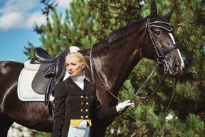 woman jockey with his horse photo