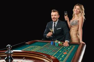 Couple playing roulette wins at the casino. photo