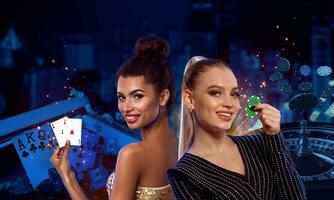 Young models are smiling, showing two green chips and aces. Posing on colorful background with roulette and flying chips. Poker, casino. Close-up photo