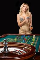 woman in a smart dress plays roulette. photo