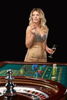 woman in a smart dress plays roulette. photo