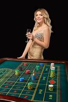 woman in a smart dress plays roulette. photo