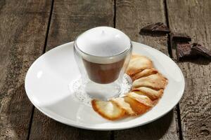 Chocolate mousse with whipped egg whites and shortbread chips photo