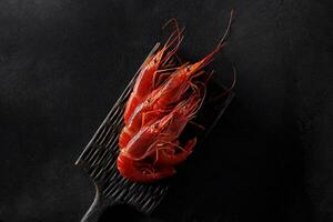 Top view of raw giant red prawns on serving board photo