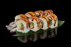 Sushi rolls with butterfish, cream cheese, cucumber, tobiko photo