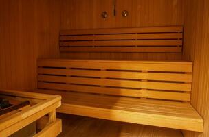 Finnish sauna interior finished with natural light wood photo