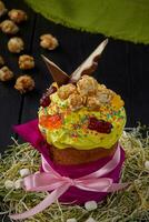 Easter cake with yellow whipped egg whites and sweets photo