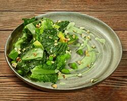 Salad of lettuce, cucumber, avocado and edamame soybeans photo