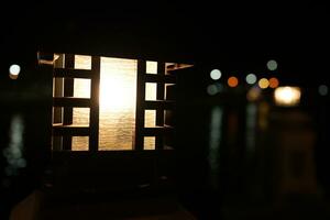 Lanterns illuminate the park at night. photo