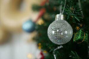 Merry Christmas 2024 concept Christmas balls are used to decorate the Christmas tree at family parties. photo