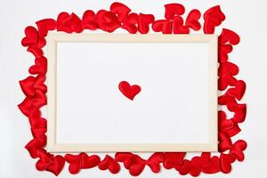 Valentine's day greeting card. Frame from red hearts on a white background. Layout with place for text. photo