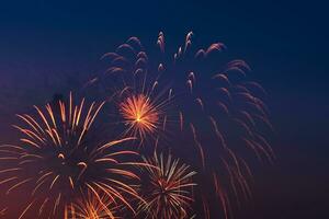 Bright colored fireworks on blue sky background. photo