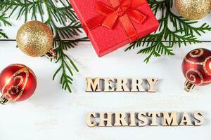 Merry Christmas concept. Gift boxes and festive decor on white background. photo