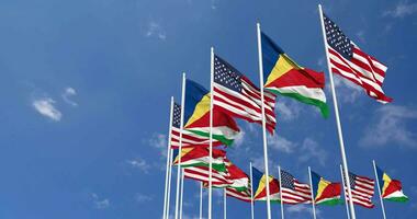United States and Seychelles Flags Waving Together in the Sky, Seamless Loop in Wind, Space on Left Side for Design or Information, 3D Rendering video