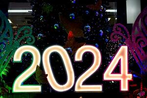 2024 number light sign with New Year and Christmas themes photo