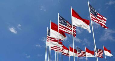 United States and Indonesia Flags Waving Together in the Sky, Seamless Loop in Wind, Space on Left Side for Design or Information, 3D Rendering video