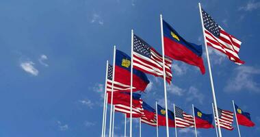 United States and Liechtenstein Flags Waving Together in the Sky, Seamless Loop in Wind, Space on Left Side for Design or Information, 3D Rendering video