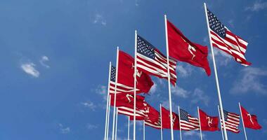 United States and Isle of Man Flags Waving Together in the Sky, Seamless Loop in Wind, Space on Left Side for Design or Information, 3D Rendering video