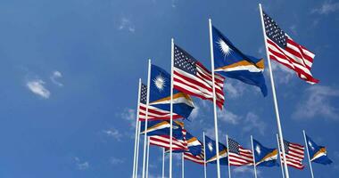 United States and Marshall Islands Flags Waving Together in the Sky, Seamless Loop in Wind, Space on Left Side for Design or Information, 3D Rendering video