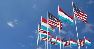 United States and Luxembourg Flags Waving Together in the Sky, Seamless Loop in Wind, Space on Left Side for Design or Information, 3D Rendering video