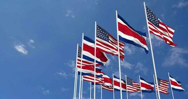 United States and Costa Rica Flags Waving Together in the Sky, Seamless Loop in Wind, Space on Left Side for Design or Information, 3D Rendering video