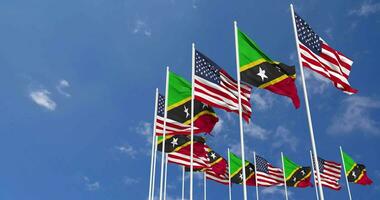 United States and Saint Kitts and Nevis Flags Waving Together in the Sky, Seamless Loop in Wind, Space on Left Side for Design or Information, 3D Rendering video