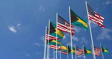 United States and Bahamas Flags Waving Together in the Sky, Seamless Loop in Wind, Space on Left Side for Design or Information, 3D Rendering video