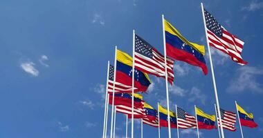 United States and Bolivarian Republic of Venezuela  Flags Waving Together in the Sky, Seamless Loop in Wind, Space on Left Side for Design or Information, 3D Rendering video