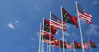 vereinigt Zustände und Papua Neu Guinea Flaggen winken zusammen im das Himmel, nahtlos Schleife im Wind, Raum auf links Seite zum Design oder Information, 3d Rendern video