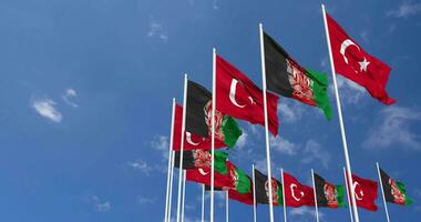 Afghanistan and Turkey Flags Waving Together in the Sky, Seamless Loop in Wind, Space on Left Side for Design or Information, 3D Rendering video