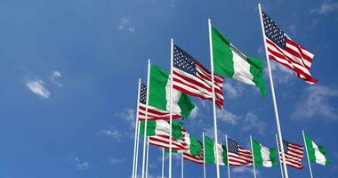 United States and Nigeria Flags Waving Together in the Sky, Seamless Loop in Wind, Space on Left Side for Design or Information, 3D Rendering video