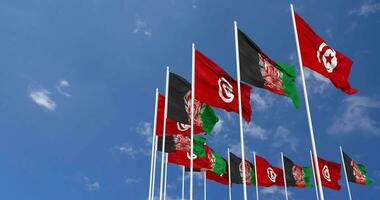 Afghanistan and Tunisia Flags Waving Together in the Sky, Seamless Loop in Wind, Space on Left Side for Design or Information, 3D Rendering video