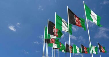 Afghanistan and Nigeria Flags Waving Together in the Sky, Seamless Loop in Wind, Space on Left Side for Design or Information, 3D Rendering video