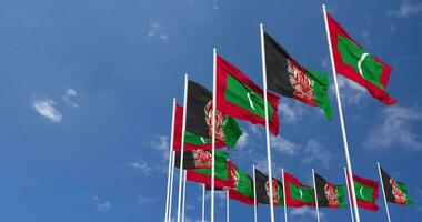 Afghanistan and Maldives Flags Waving Together in the Sky, Seamless Loop in Wind, Space on Left Side for Design or Information, 3D Rendering video