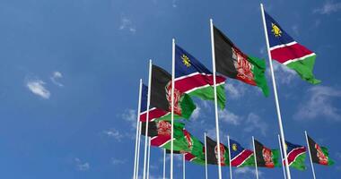 Afghanistan and Namibia Flags Waving Together in the Sky, Seamless Loop in Wind, Space on Left Side for Design or Information, 3D Rendering video