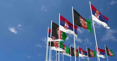 Afghanistan and Serbia Flags Waving Together in the Sky, Seamless Loop in Wind, Space on Left Side for Design or Information, 3D Rendering video
